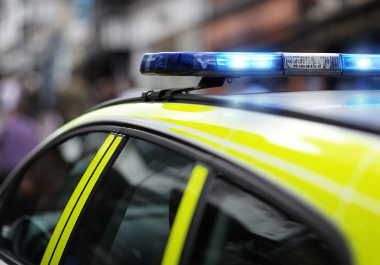 Police siren flashing blue lights at accident or crime scene Police siren flashing blue lights at accident or crime scene
